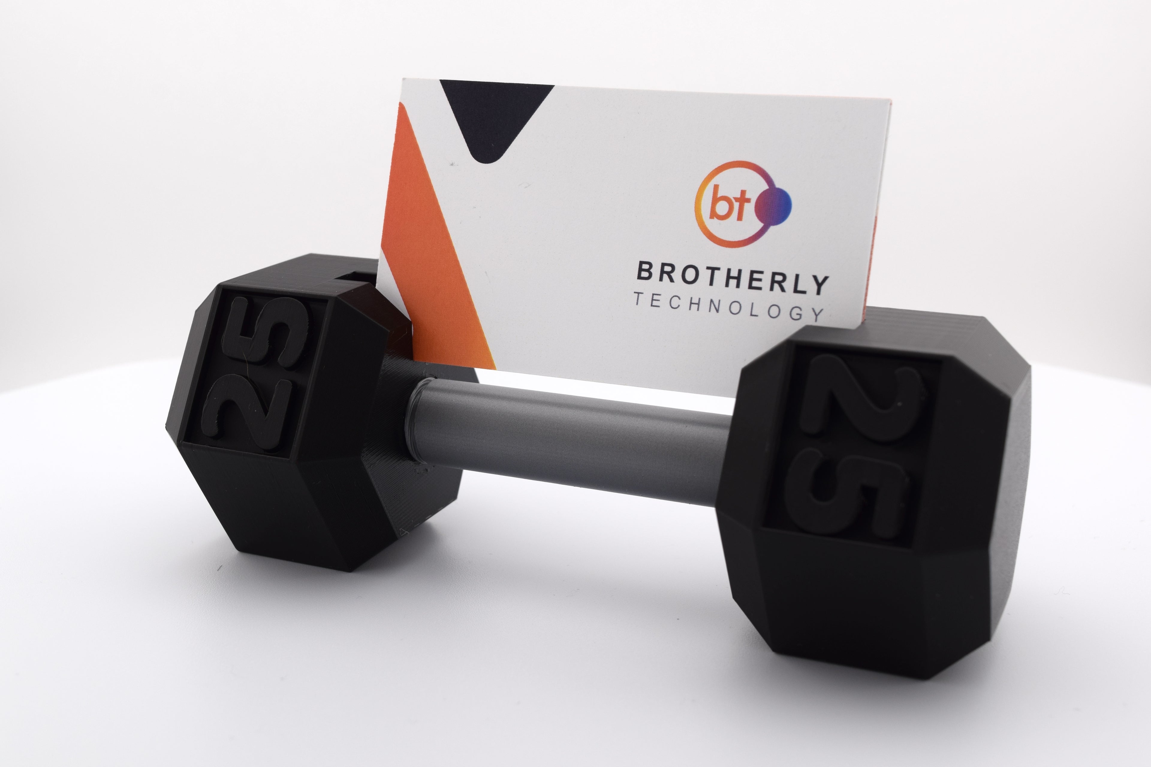 Miniature dumbbell-shaped business card holder, holding standard business cards. Made from durable 3D-printed plastic, it features a sleek and sturdy design, perfect for fitness enthusiasts or professionals. A stylish and functional accessory that combines fitness inspiration with practicality.