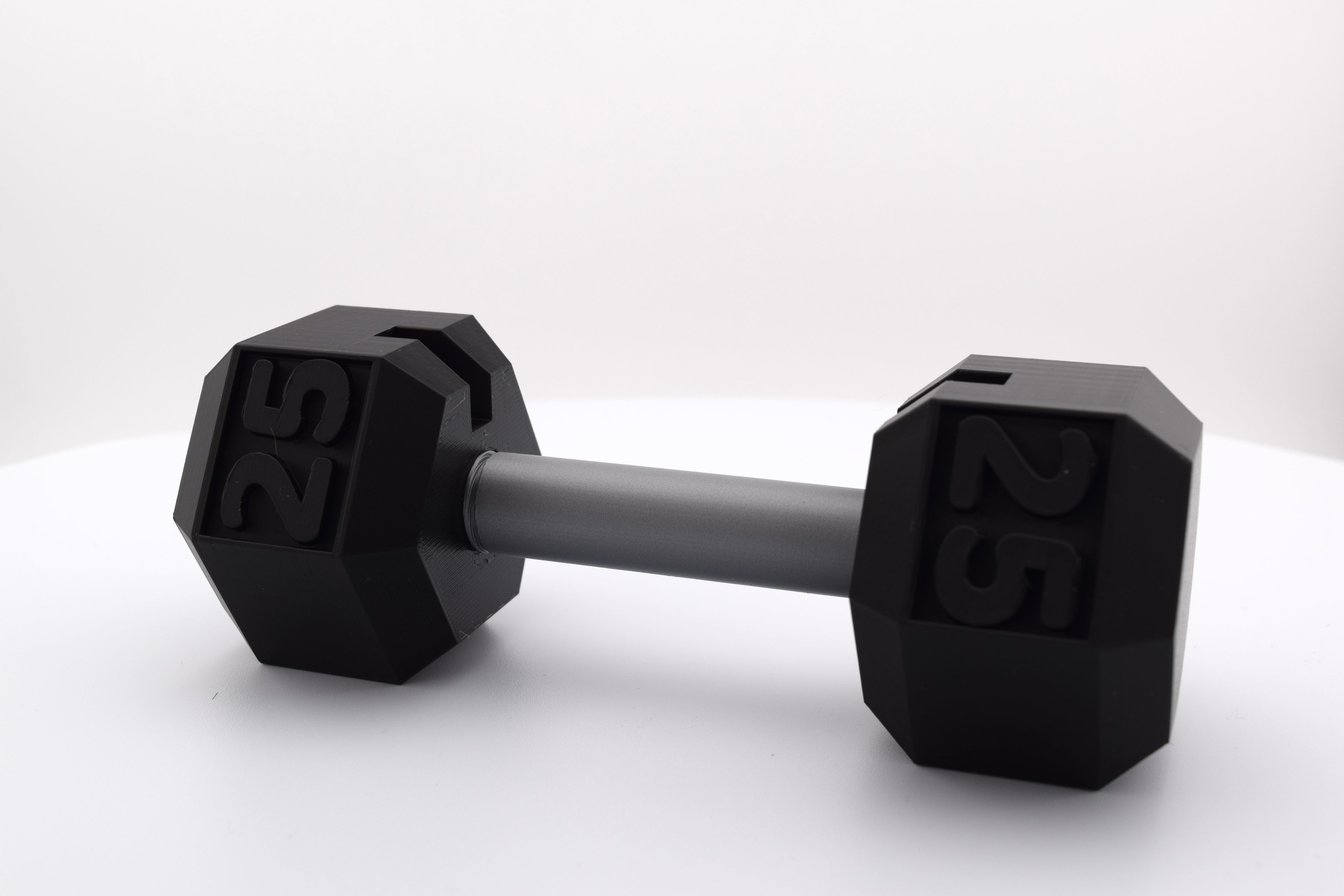 Miniature dumbbell-shaped business card holder. Made from durable 3D-printed plastic, it features a sleek and sturdy design, perfect for fitness enthusiasts or professionals. A stylish and functional accessory that combines fitness inspiration with practicality.
